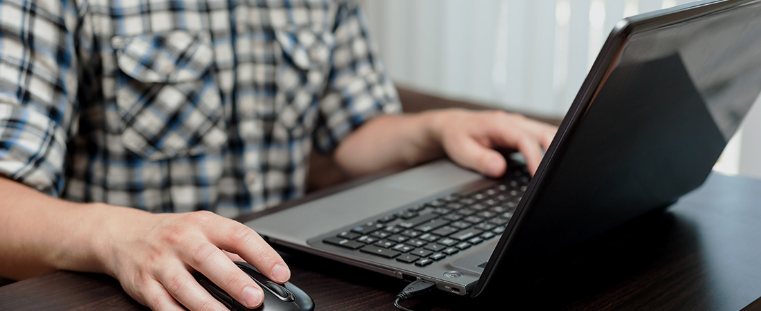 A picture of a person using a computer. A picture of a person using a computer.