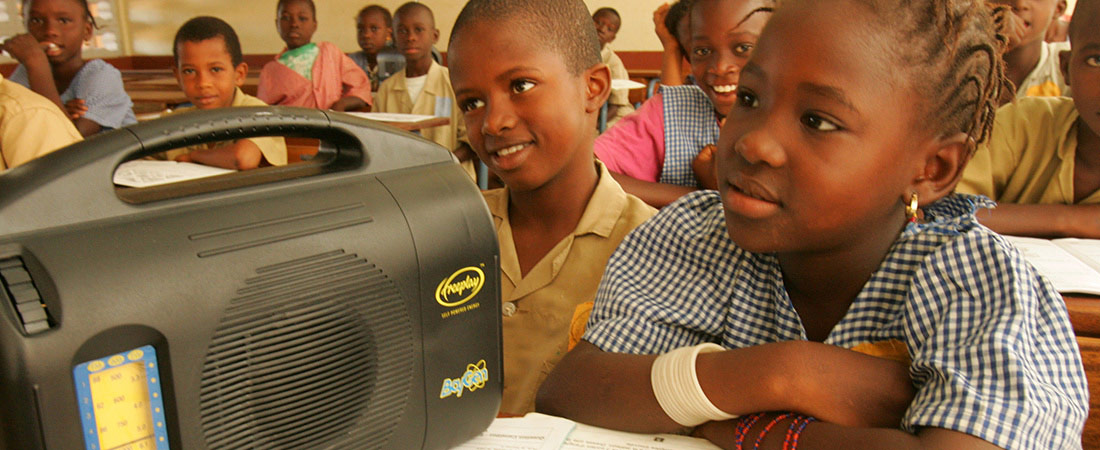 Students listening to an interactive radio instruction lesson