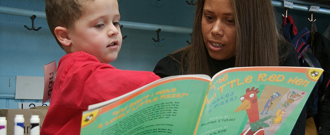 An educator with a young child An educator with a young child