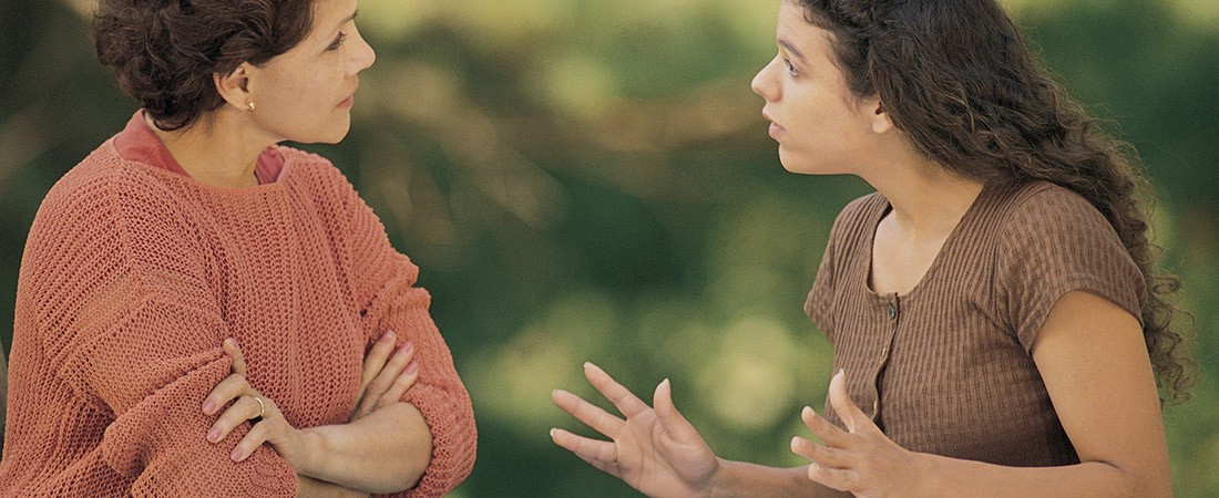 A teenager talking with her mother. A teenager talking with her mother.