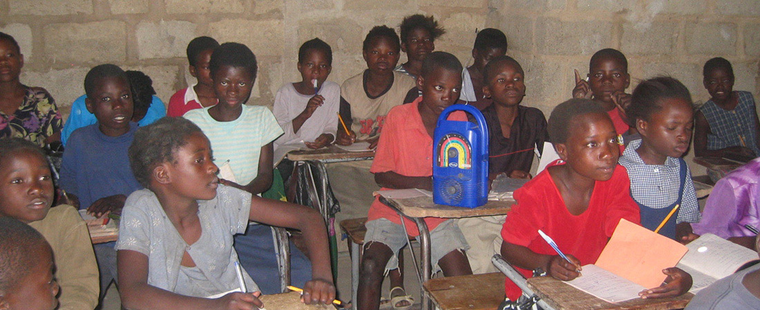 Students in Malawi listening to a radio Students in Malawi listening to a radio