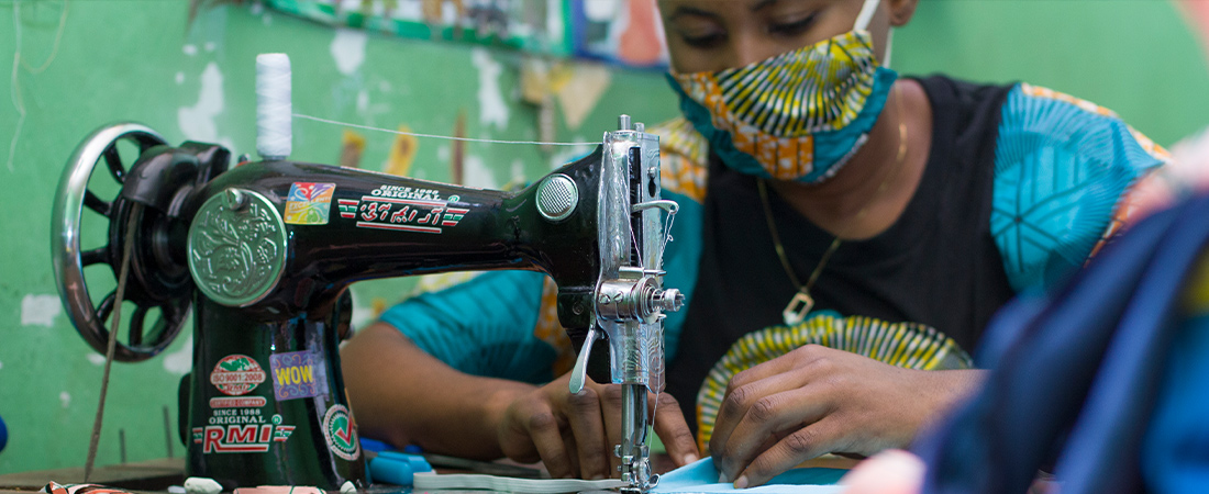 A photo of youth in DRC sewing face masks