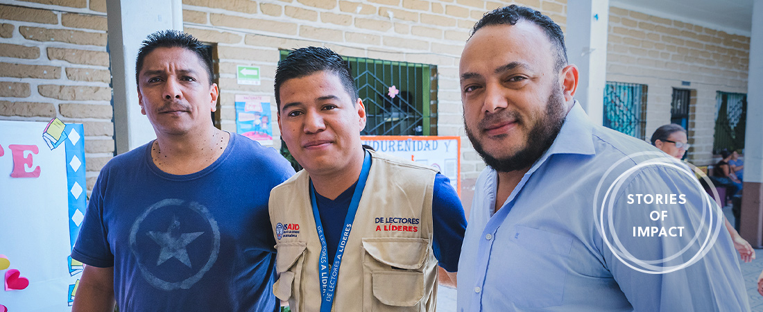Fathers Stepping Up for Literacy A photo of Walter and Juan Carlos with Ricardo Soriano