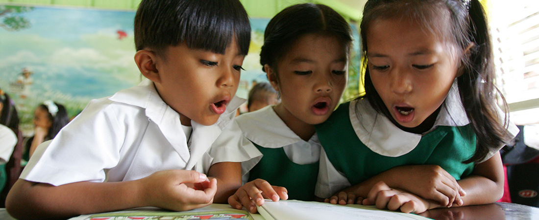 To Improve Literacy, Examine the Book Supply Chain A photo of children reading representing To Improve Literacy, Examine the Book Supply Chain