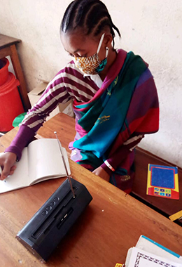 A child in the DRC tunes into learning. A photo from the DRC