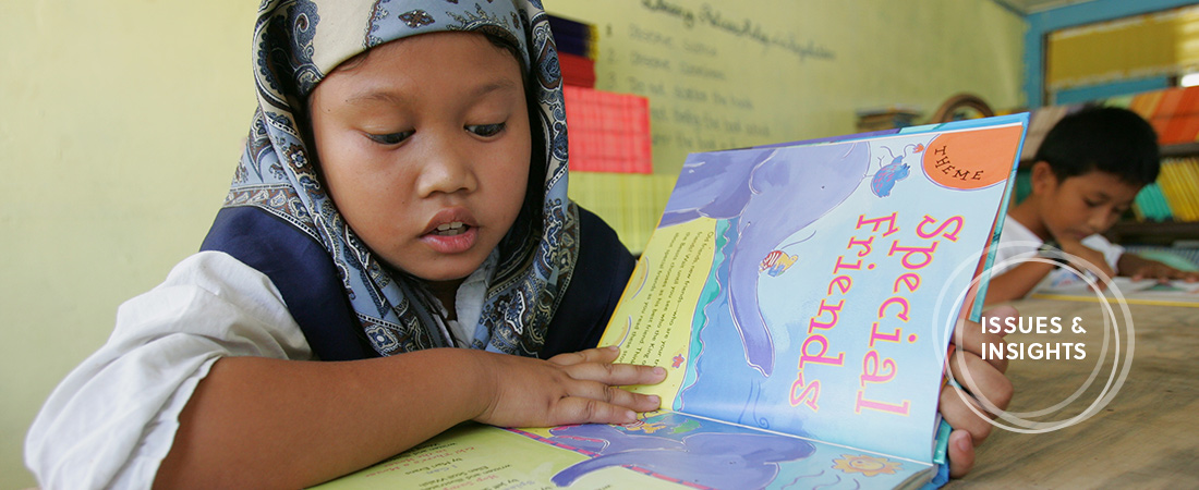 A photo of a student reading in the Philippines