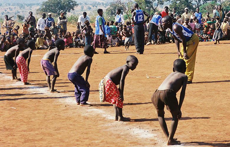 A photo of children in a refugee camp representing The Most Sacred of Goals