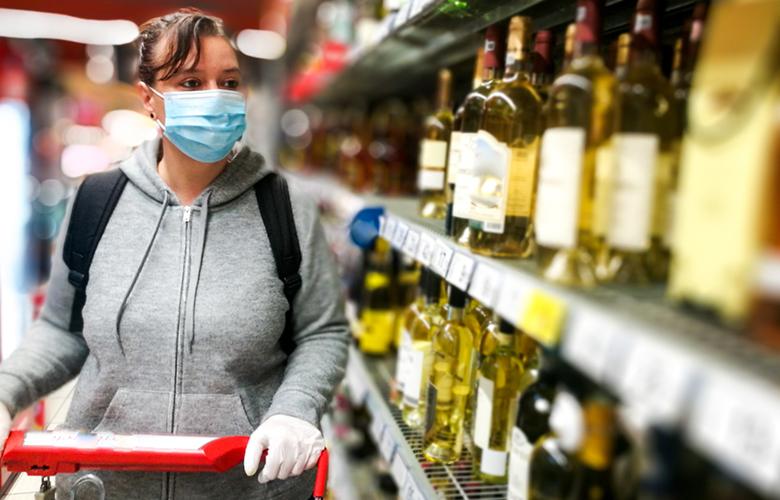 A photo of a person shopping for alcohol representing Balancing Competing Priorities: Preventing Substance Misuse during COVID-19