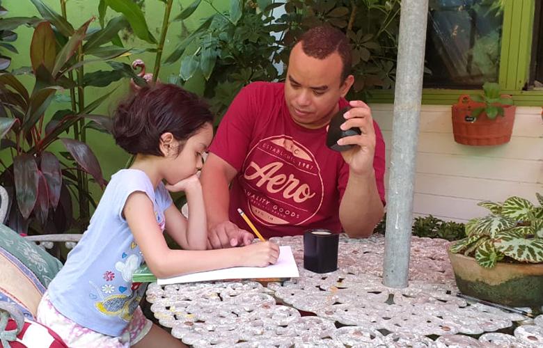 International Literacy Day—September 8 A photo of parent and child learning at home representing International Literacy Day—September 8