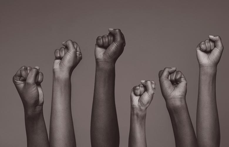 Lift Every Voice A photo of raised hands representing Lift Every Voice