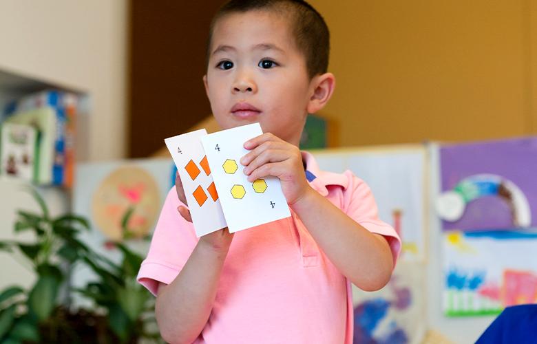 Learning Math with Your Preschoolers: Fun in the Talking and the Playing A photo of a young child doing math representing Learning Math with Your Preschoolers: Fun in the Talking and the Playing