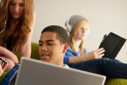 Picture of teenagers using computers.