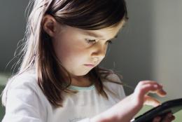 A photo of a child using a tablet.