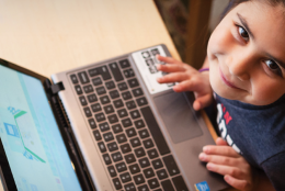 A child using a computer representing Four Resources for #CSEd Week
