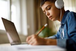 Student using a computer representing Digital Learning Day: Ways to Support Successful Online Learning