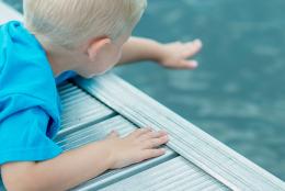 A photo of a child near a pool