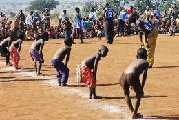 A photo of children in a refugee camp representing The Most Sacred of Goals