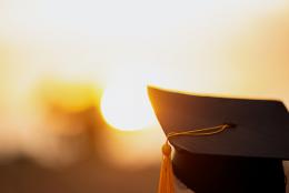 A photo of a graduate representing Championing Higher Education in Prisons