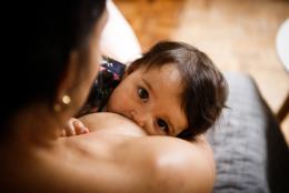 How Can We Improve Breastfeeding Rates? A photo of a child breastfeeding