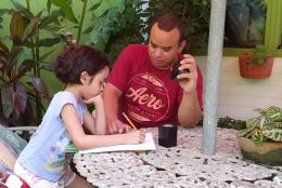 International Literacy Day—September 8 A photo of parent and child learning at home representing International Literacy Day—September 8