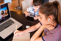 How Can Educators Address Student Trauma During COVID-19? A photo of students working from home