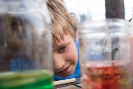 A photo of a child doing science